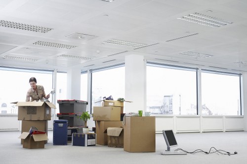 Professional office movers handling desks and equipment during a Hampstead move